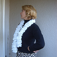 young woman in black sweater wearing a white scarf